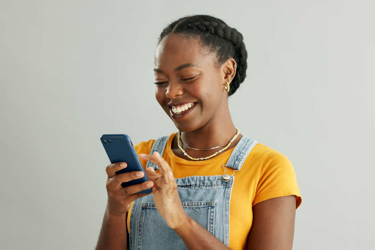 A young female person using a mobile phone